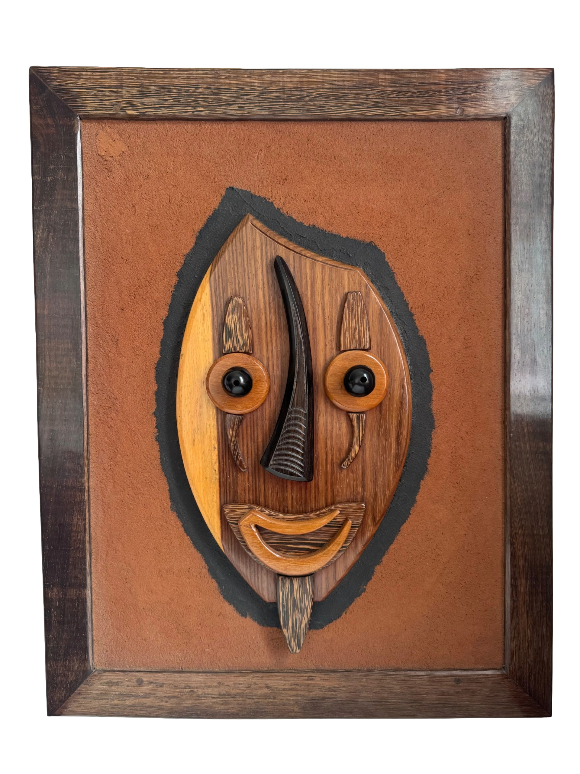 Hand-carved wood relief by Gabonese artist Casimir Zinga